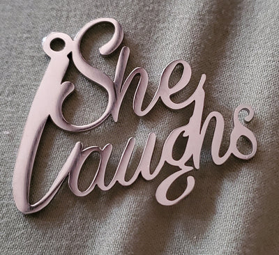 Cursive " She Laughs"